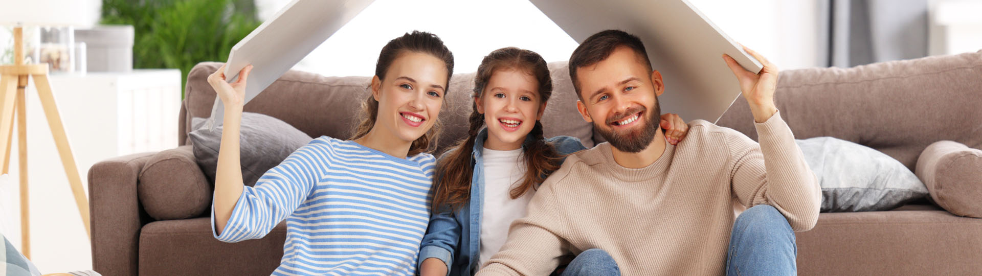 Family gathered together on the couch.